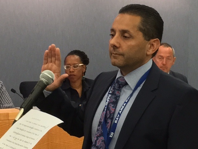 Carlos Rojas takes the oath of office