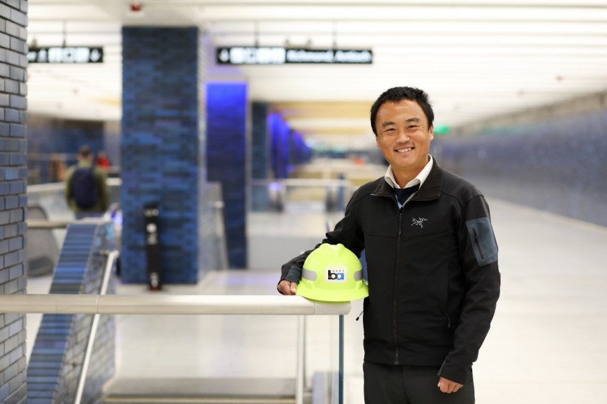 Qing Liu, Principal Structural Engineer, is pictured above at 19th St./Oakland Station. 