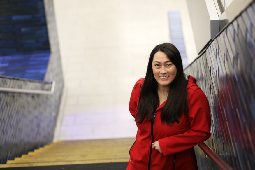 Mieko McCue, Principal Construction Engineer, is pictured above at 19th St./Oakland Station. 