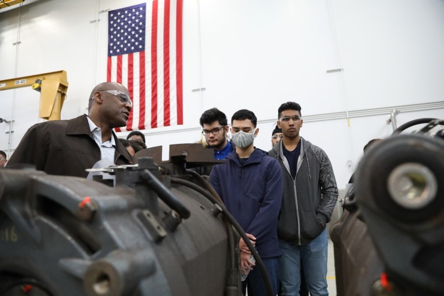 Marlon Lewis, Component Repair Maintenance Shop Superintendent, and students from Mission Valley ROP during a tour of Hayward Ma