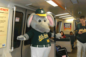 A's mascot Stomper on a BART train