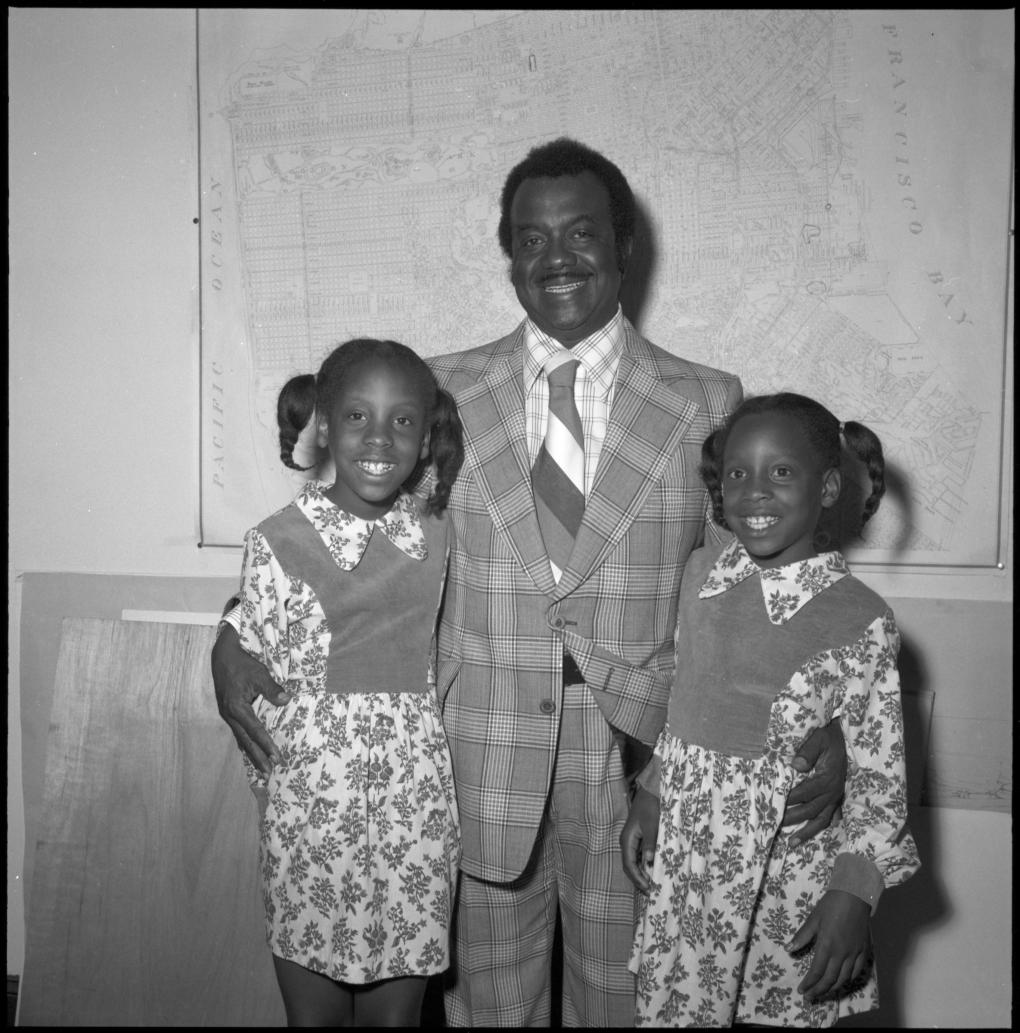 Curtis E Green pictured with his daughters.