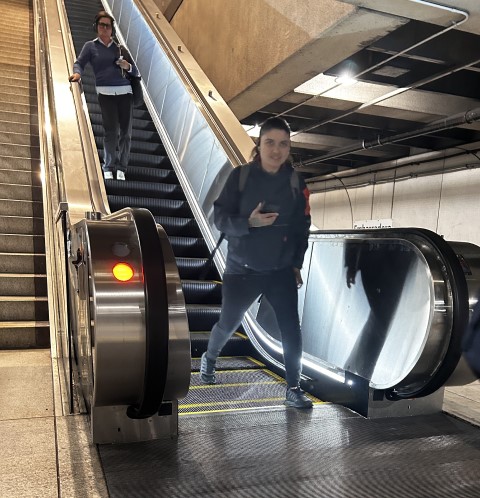 People going down an escalator