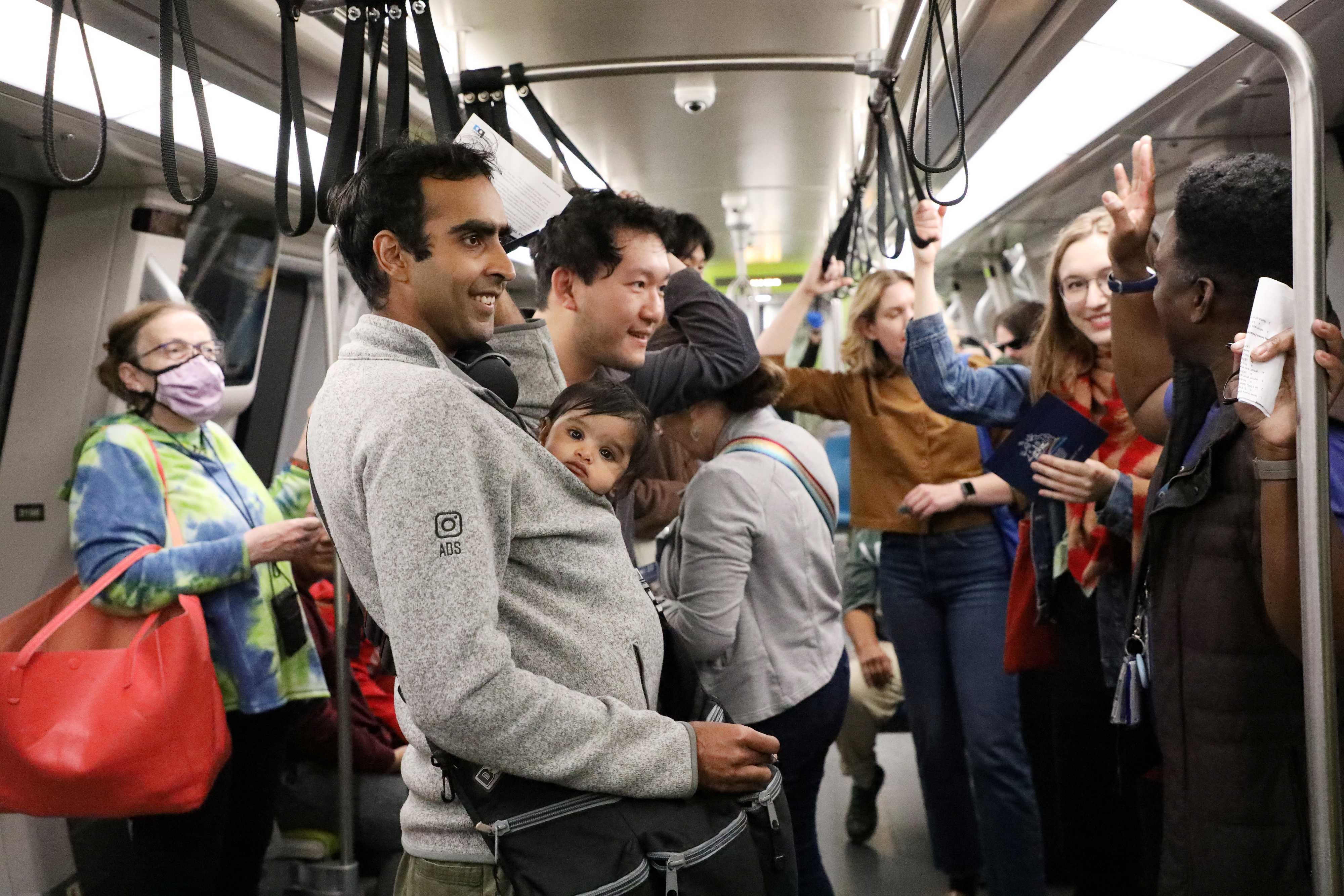 Photo of people on a BART train for the train read-in