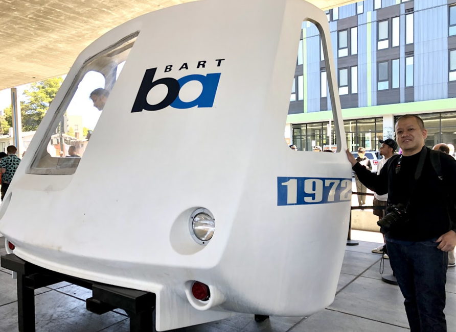 Atsushi poses with the nose of a legacy BART train