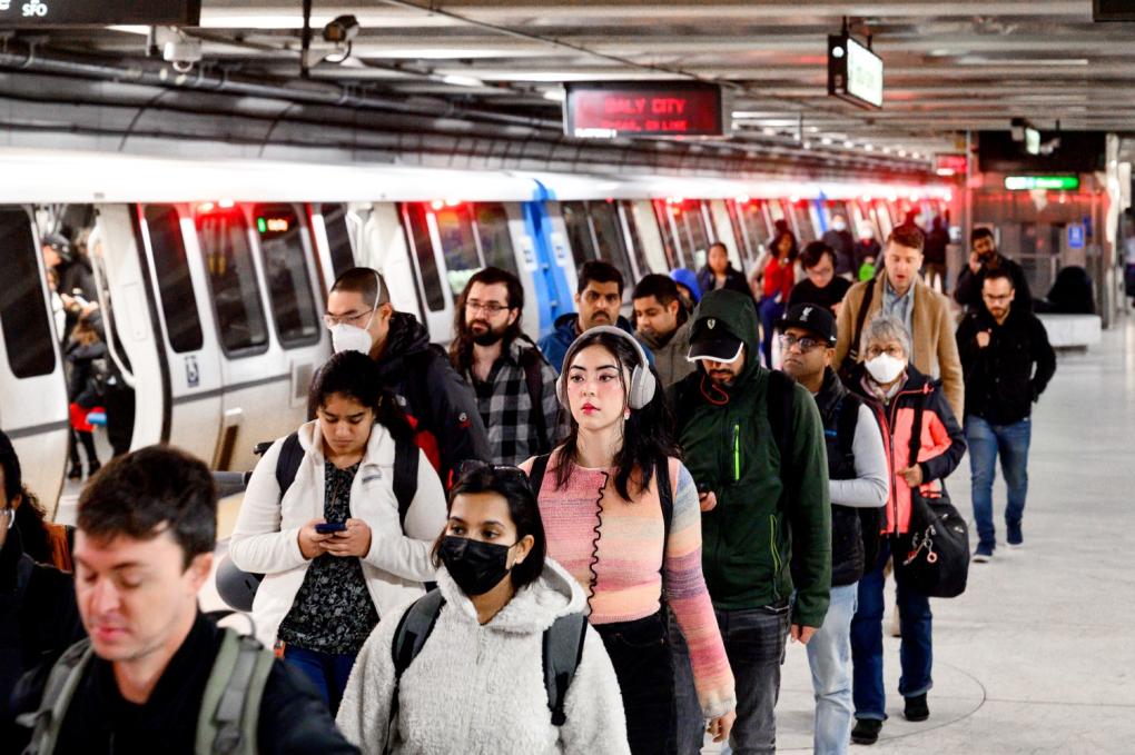 Riders exiting a station