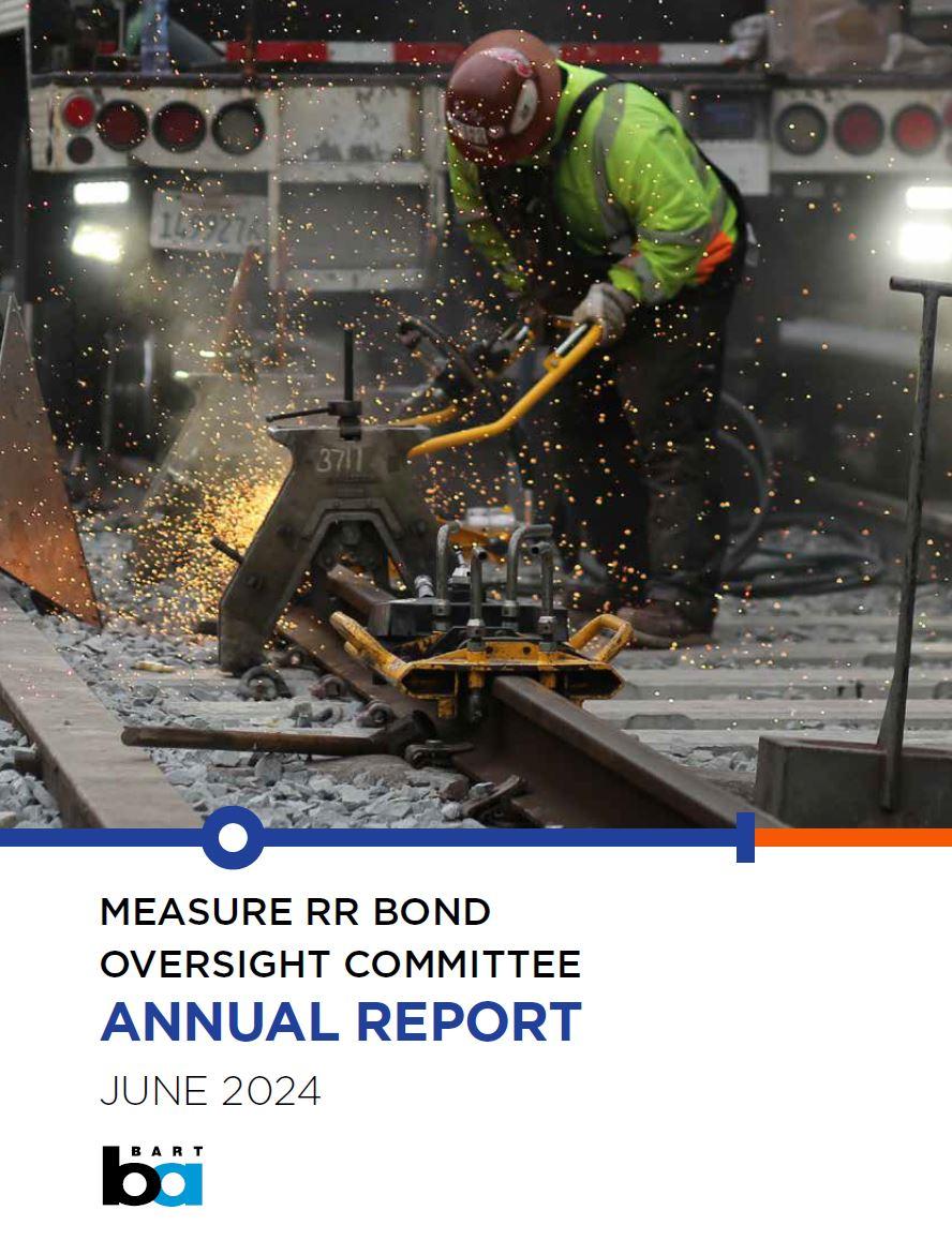Cover of the Measure RR Annual Report showing a worker using heavy equipment on the BART trackway