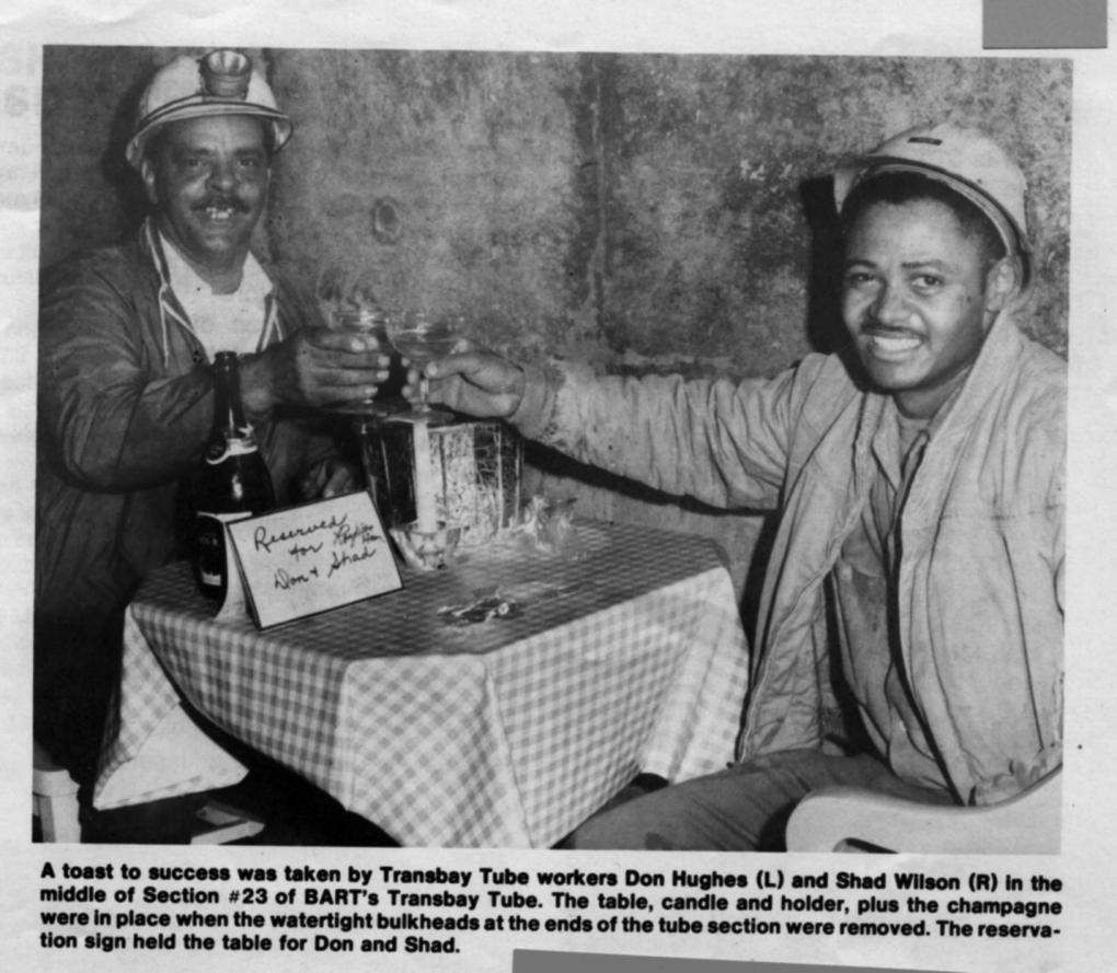 Tube sections were built from both the San Francisco and Oakland sides. When the last bulkhead was removed to finally connect the Tube, workers from the San Francisco side found Oakland-side workers Don Hughes and Shad Wilson enjoying champagne together.