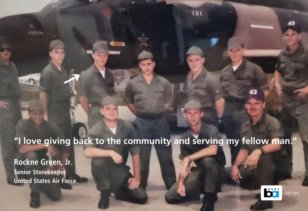 Group of United States Air Force personnel posing in front of a military aircraft, with a quote by Rockne Green, Jr. about serving the community.