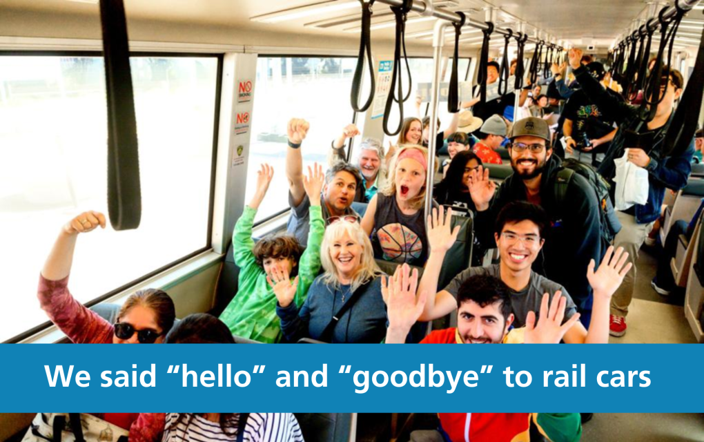 People smiling on a legacy train with the text "We said hello and goodbye to rail cars"