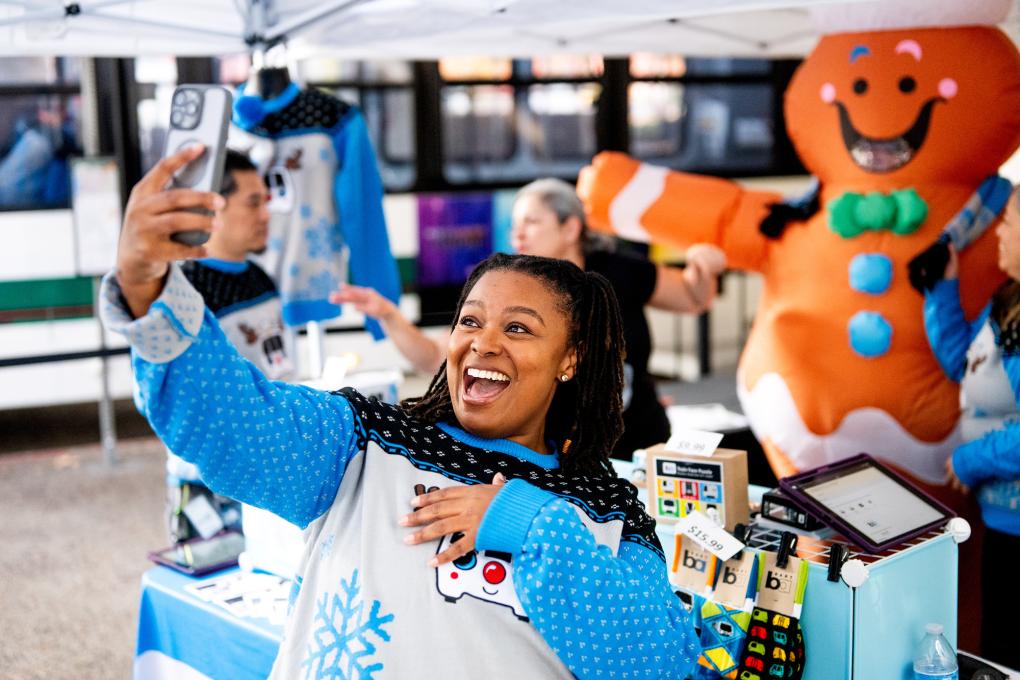 A person taking a selfie with the gingerbread man